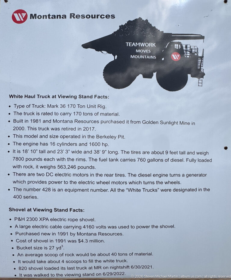 Interpretive sign with silhouette of mining equipment and specifications for a Montana Resources white haul truck and electric rope shovel.