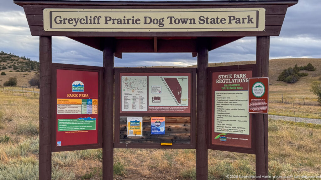Timber entrance kiosk for Grey Cliff Prairie Dog Town State Park with fee, map, and regulation panels.