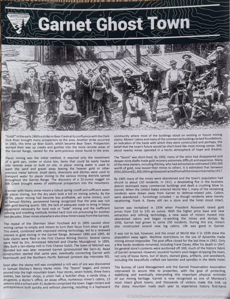Large Garnet Ghost Town interpretive panel with a historic mining photograph above multiple columns of community and mining history.