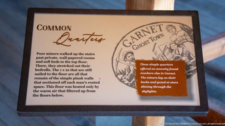 Interpretive panel titled Common Quarters describing simple sleeping rooms at Garnet Ghost Town.