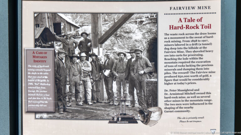 Fairview Mine interpretive panel titled A Tale of Hard-Rock Toil, with a historic group portrait of miners at a mine entrance.