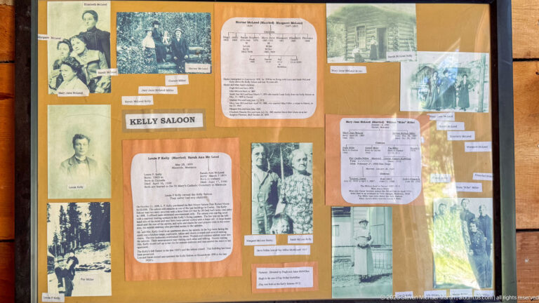 Kelly Saloon display board filled with labeled historic portraits, documents, family photographs, and genealogical material.