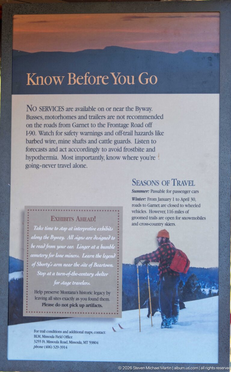 Know Before You Go visitor panel with travel warnings, seasonal information, and a photograph of a person traveling through deep snow.