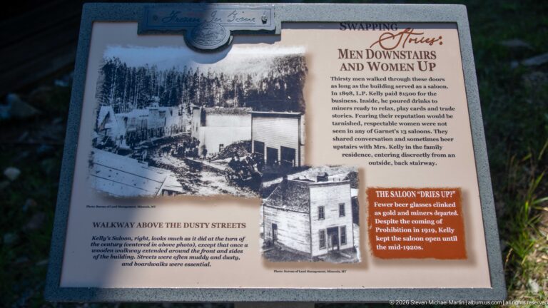 Wells Hotel interpretive panel titled Men Downstairs and Women Up with historic exterior photographs and text about room use.